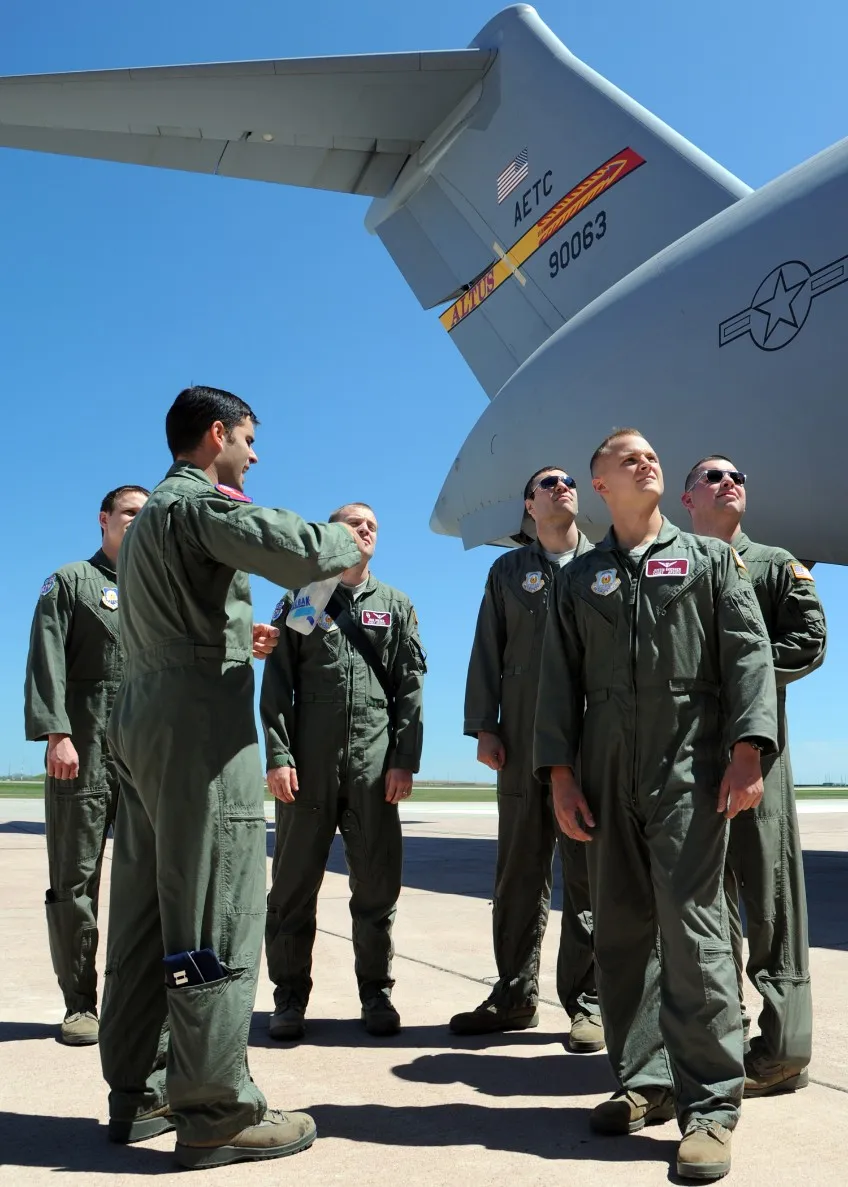 Air Force ROTC cadets beside a C-17 transport aircraft on the flightline
