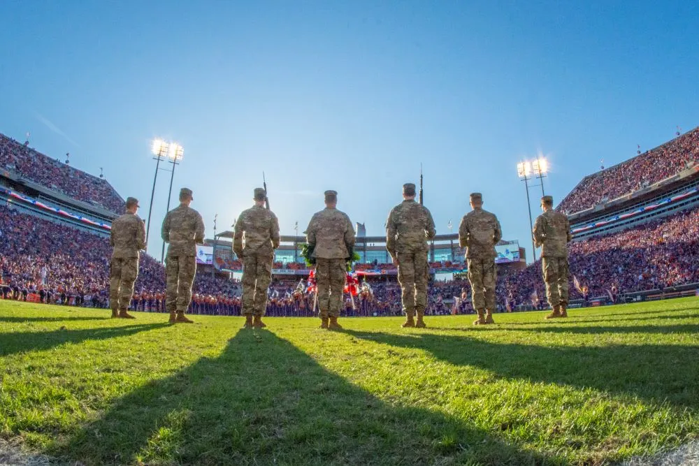 Army ROTC cadets standing in formation on a university campus