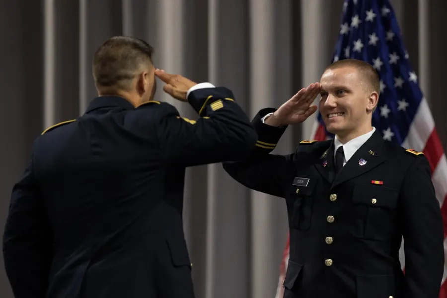 A newly commissioned Army officer receiving a first salute at a commissioning ceremony