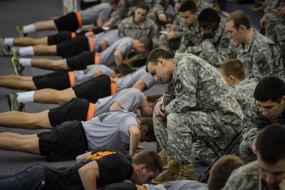 Army ROTC cadets pushing through a timed physical fitness test