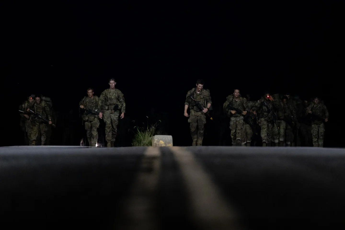 Army ROTC cadets carrying rucksacks on the 12 mile march at Cadet Summer Training, Fort Knox
