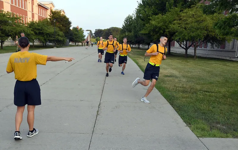 Navy ROTC midshipmen running the timed 1.5 mile during a physical readiness assessment